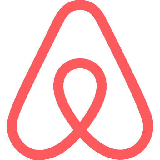 Red abstract logo: a rounded triangular outline with a looping interior forming a heart-like shape.
