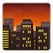 City skyline at sunset with orange sky and illuminated windows in tall buildings.